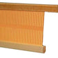 Close-up view of the Leclerc 24" Bergere Rigid heddle Reed by Leclerc Looms, featuring a series of vertical slots (dents) for keeping the warp threads separate. The reed is attached to a rectangular wooden frame.