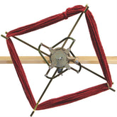 A close-up of the Leclerc Swift and Skein Winder, crafted by Leclerc Looms, shows its metal construction and four adjustable skeiner arms extending outward to hold a skein of red yarn. Mounted on a wooden rod, this timeless piece exudes the classic design reminiscent of vintage swirl winders.