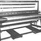 Black and white image of a large, industrial Leclerc Kebec II 4-Shaft Floor Loom by Leclerc Looms. The loom features a wide horizontal design with rollers and a metal framework, likely used for weaving or processing large rolls of fabric.