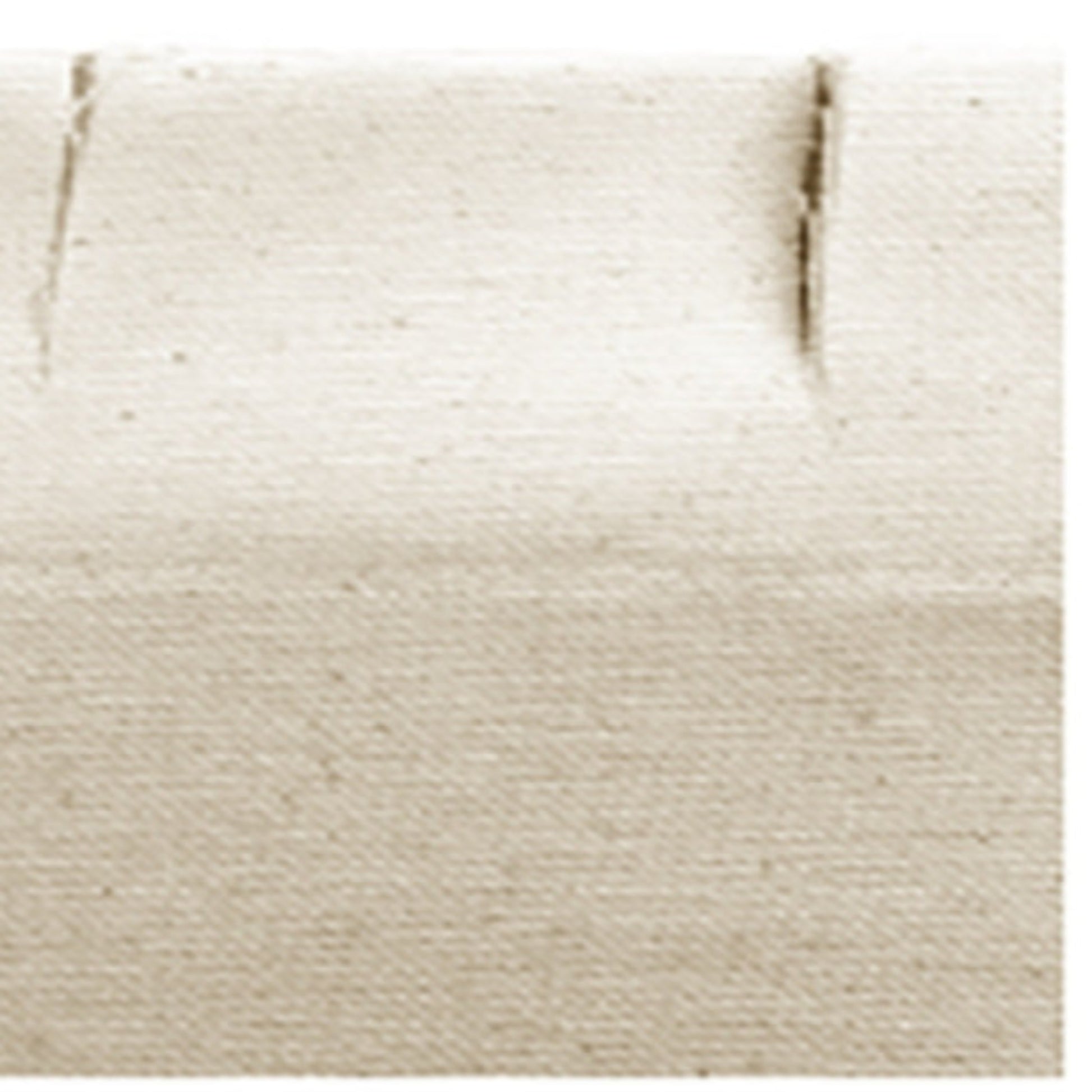 Close-up of the textured edge of a block of tofu, displaying its creamy beige color and smooth surface with subtle creases and lines, reminiscent of a finely woven Leclerc Looms Leclerc Canvas Apron.