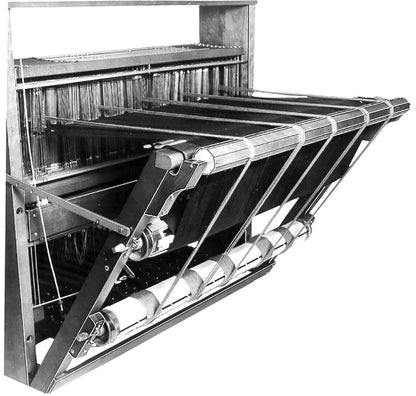 Black and white image of the Leclerc Double Warp Beam Standard, an intricate mechanical loom by Leclerc Looms, showcasing its various components including weaving frames, pulleys, and threads. This loom exemplifies the complex mechanisms and historical significance of early 20th-century textile manufacturing advancements.