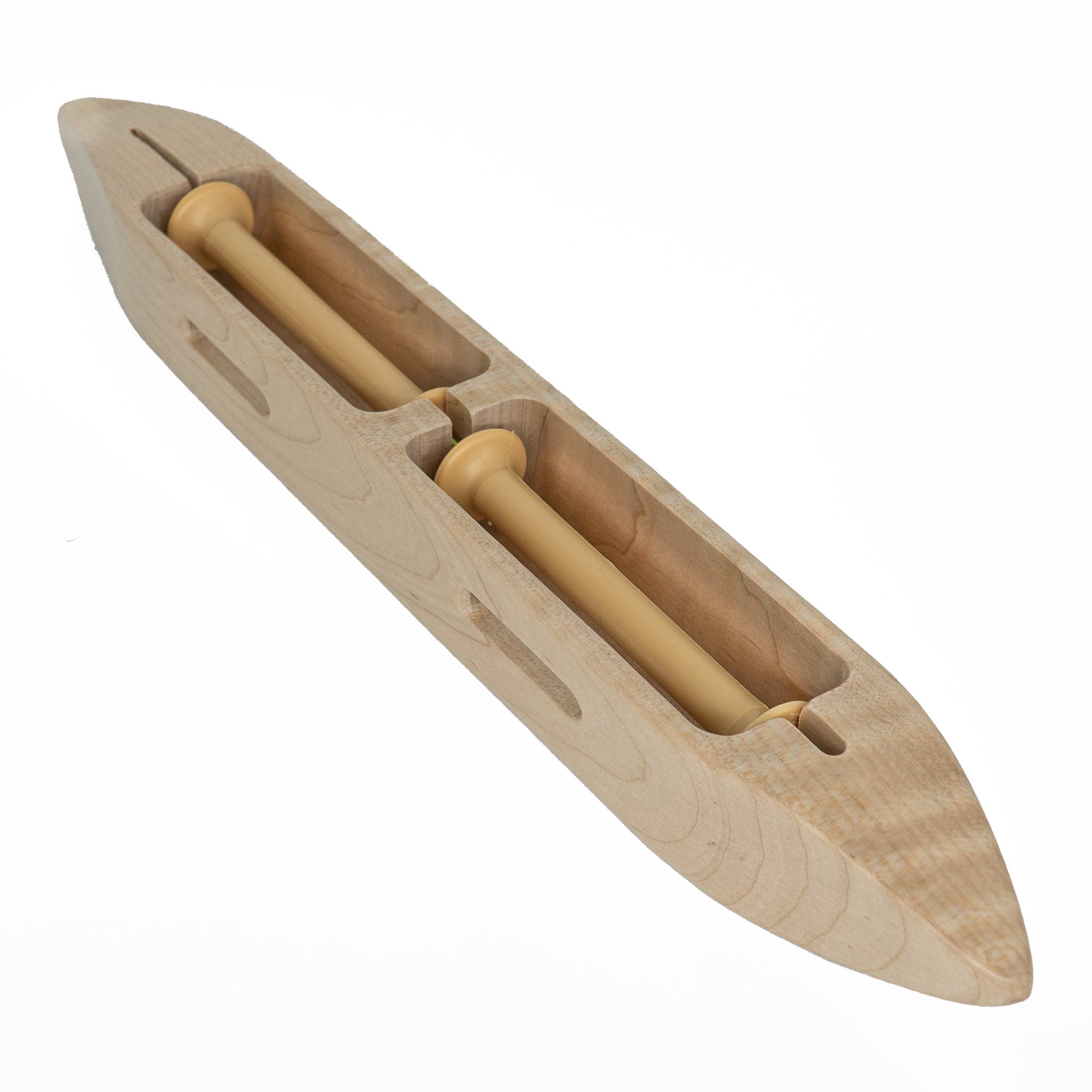 The Leclerc Double-Bobbin Boat Shuttle by Leclerc Looms features a smooth, polished wooden finish and two central compartments housing 4 in Leclerc bobbins. Designed with a pointed, narrow end, this boat-shaped shuttle facilitates weaving and ensures even tension throughout the process.