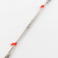 A length of the Wire Repair Heddle by Leclerc Looms, resembling flat steel, is neatly bundled together with two red plastic ties, placed near each end. The straight wire appears clean and untarnished against a plain white background.