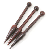 Three Tapestry Bobbins, each 7.5 inches in length and hand-crafted from sustainable sheesham wood by High Standard, are placed side by side on a white background. Each bobbin features a rounded ball handle that transitions into a tapering body ending in a pointed tip. The polished finish highlights the rich color and smooth texture of the wood.