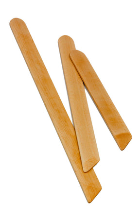 Three Schacht Shed Sticks - Weaving Swords from Schacht Spindle Co. of varying lengths are arranged on a white surface. The two longer sticks run parallel to each other, while the shorter one is placed diagonally across them. Each stick showcases a smooth finish with visible wood grain patterns.