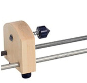 A wooden tool with a metal rod and a black rubber end cap, resembling the Schacht Double Ended Electric Bobbin Winder Live Center Replacement Kit by Schacht Spindle Co., equipped with an adjustable screw mechanism for tightening or loosening.