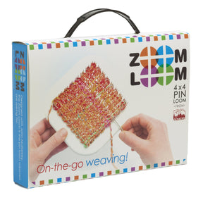 A Schacht Spindle Co. Schacht Zoom Loom 4" x 4" pin loom kit box with a multicolored woven square displayed on the front. Two hands hold a weaving tool and the edge of the woven piece. The box features a colorful border and the tagline "On-the-go weaving!" Perfect for craft enthusiasts looking for a portable weaving kit!