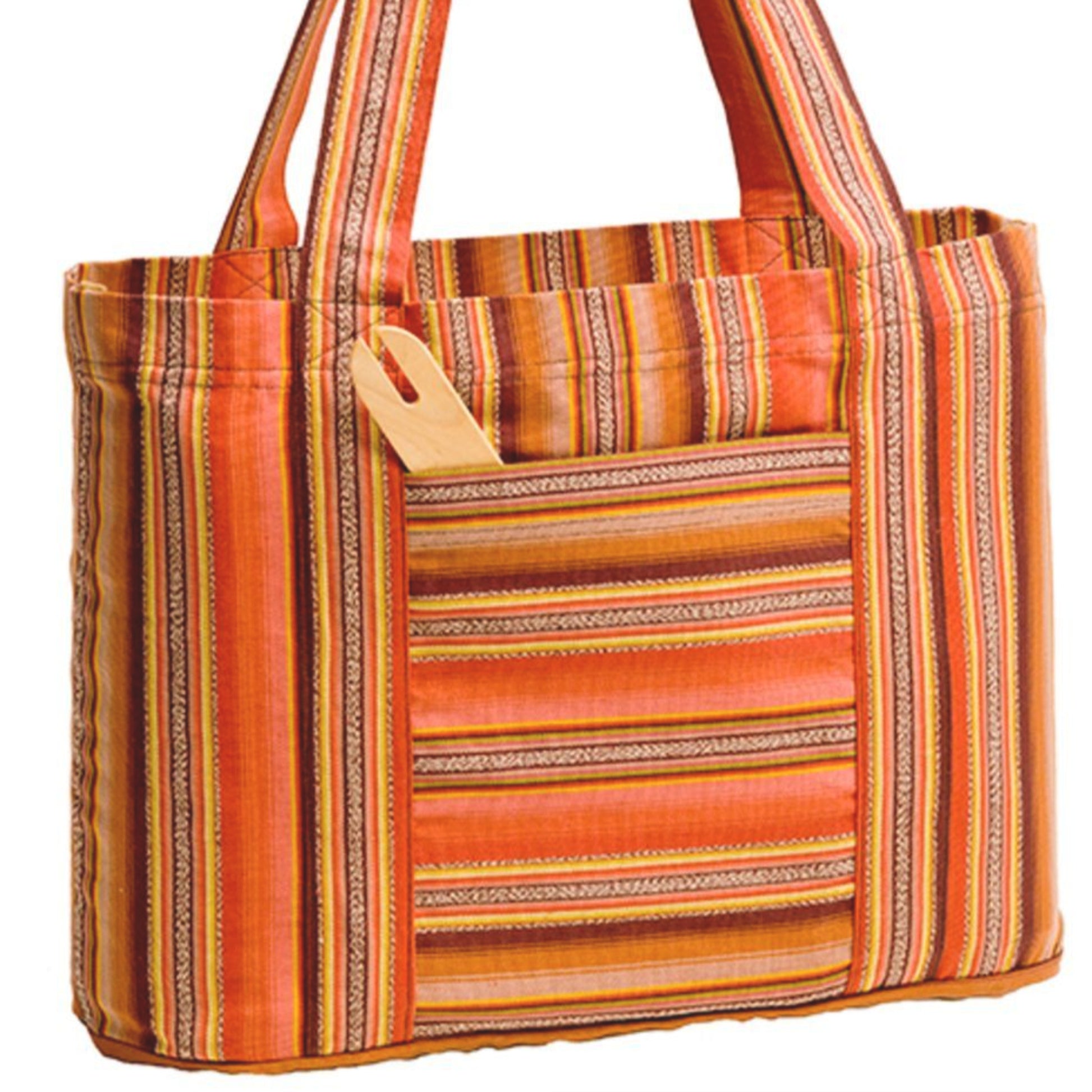 A vibrant and colorful Cricket Loom Bag from Schacht Spindle Co. features an alternating stripe pattern of various widths and textures, with shades of orange, red, and yellow. The bag has two fabric handles and includes an external pocket that holds a wooden comb.