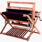 The Schacht Wolf Loom, 4 Later Add on Kit by Schacht Spindle Co. is a wooden handloom weaving machine featuring a rectangular frame and essential components like a warp beam, heddles, and reed. It includes a crank handle on one side and is designed for small-scale weaving projects, making it perfect for weaving enthusiasts.