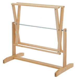 Experience the Schacht 18 Yd Warping Reel - Horizontal by Schacht Spindle Co., a wooden art easel with an adjustable frame and a sturdy base, akin to a horizontal warping mill. This versatile easel features a horizontal bar, which may provide extra support or hold your canvas in place. Its simple and functional design makes it ideal for supporting various sizes of canvases or drawing boards.