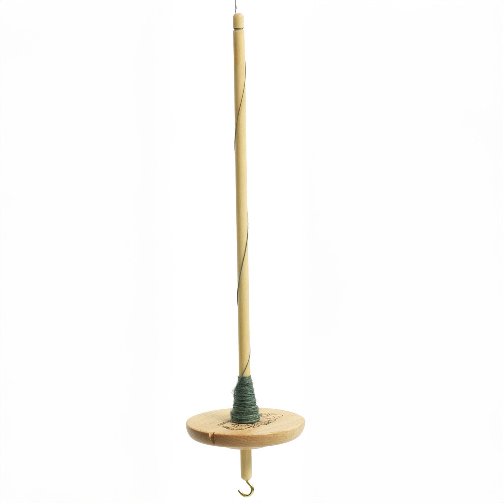 The Schacht Hi-Low Drop Spindle from Schacht Spindle Co. features a wooden shaft with a whorl at the bottom, green thread wound around both components, and a small metal hook attached to the bottom of the shaft. The spindle is displayed vertically against a white background.