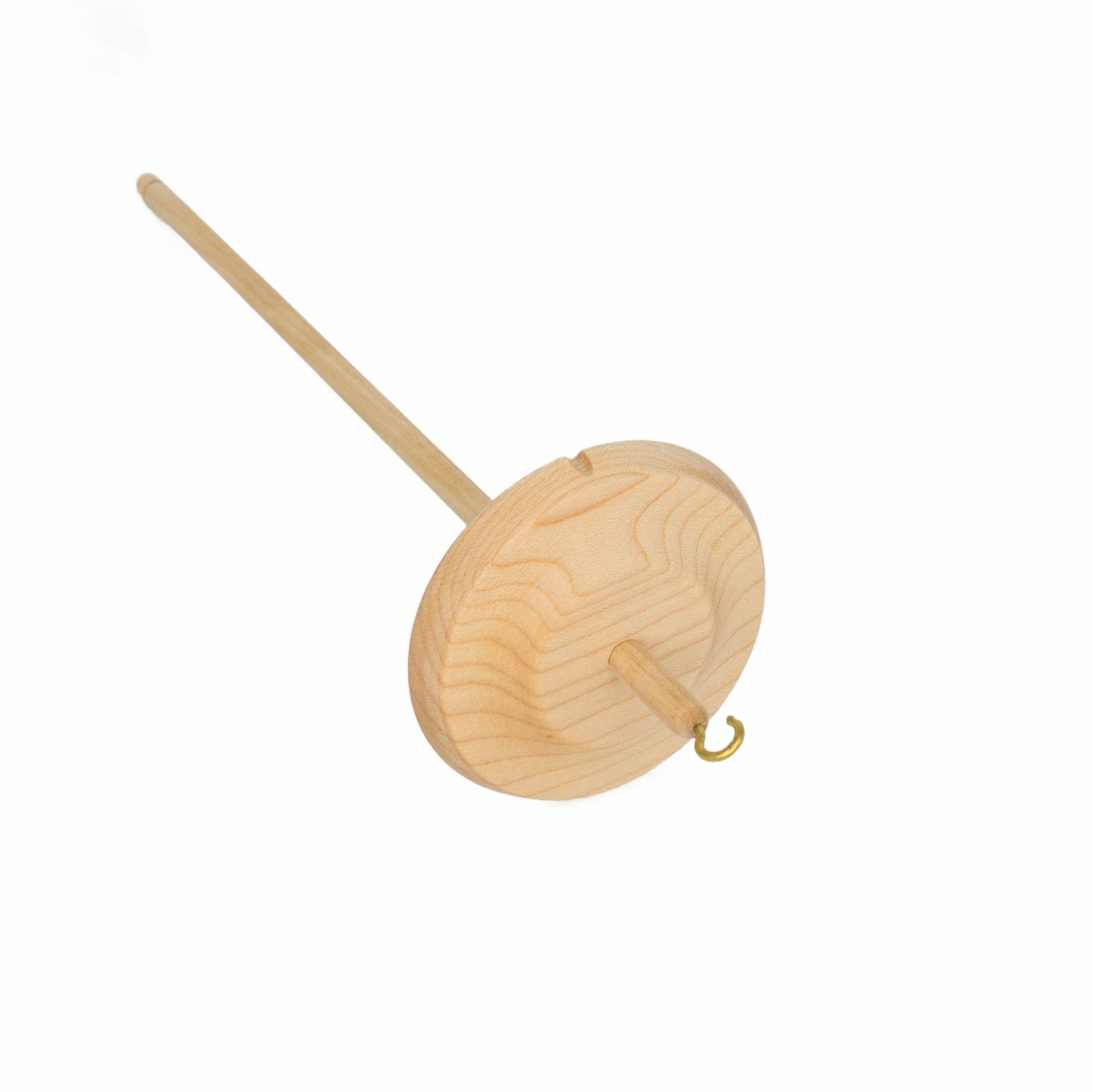 The Schacht Hi-Low Drop Spindle by Schacht Spindle Co. is a lightweight wooden spindle featuring a long, thin shaft with a round, flat whorl positioned near the bottom. It has a small metal hook at the top of the shaft and is designed specifically for hand-spinning fibers into yarn. The background is white.