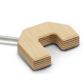 A Schacht Raddle U-Bracket by Schacht Spindle Co., featuring a light, natural finish on its wooden U-shape with a striped layer pattern and an attached metal rod on one side, is positioned against a plain white background. This item is perfect as a loom accessory for Wolf looms.