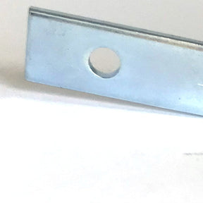 A close-up image of the Schacht Top Pawl for Wolf Looms Cloth Beam from Schacht Spindle Co. The rectangular metal piece features a circular hole near one end and is set against a plain white background, showcasing its slightly reflective, polished surface which indicates it's a precise replacement part for Wolf looms.