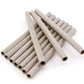 A collection of Glimakra Paper Quills (10/pack), reusable and textured like weaving bobbins, lies haphazardly on a white background. These light-colored quills feature a dotted pattern and have hollow centers.