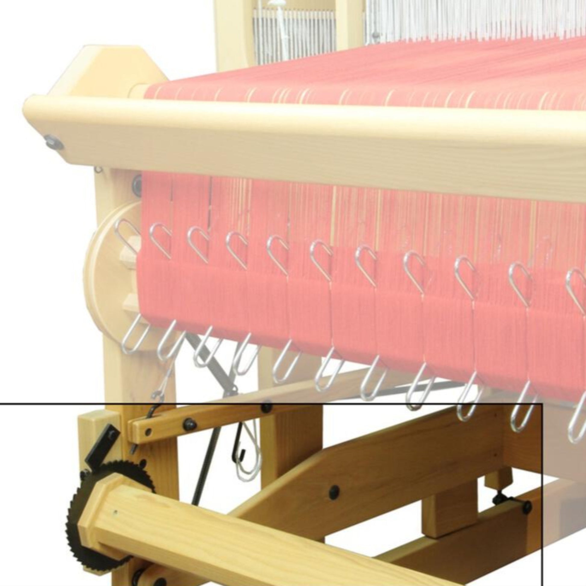 A close-up view of the Louët Second Warp Beam for the Megado Loom from Louët Inc., showcasing pink threads being meticulously woven. The loom's various components, such as metal hooks and gears, are clearly visible. This intricate setup highlights the detailed process of weaving fabric.