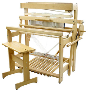 Introducing the Louët David 3, an 8-shaft floor loom by Louët Inc., paired with a matching wooden bench. This robust loom features multiple levers, pedals, and strings arranged for the weaving process. Several heddles are visible, showcasing its sturdy construction and natural wood finish.