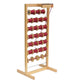 The Louët Bobbin/Spool Rack, exclusively by Louët Inc., features a finely crafted wooden spool rack equipped with multiple horizontal rods, capable of holding up to 32 red spools that are likely filled with thread or string. Its upright rectangular frame and flat base ensure stability, making it an ideal choice for sectional warping and perfectly accommodating wooden flanged bobbins.