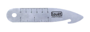 The Louët Reed Hook by Louët Inc., made in Holland, is a traditional metallic thread cutter and gauge. This smooth tool features a small ruler with measurements in centimeters, a circular hole at one end, and a hooked edge for cutting threads on the opposite end.