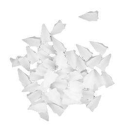 A cluster of Texsolv Loopcord spacers for Louët David, Octado, and Megado Looms (30/pack) by Glimakra; irregularly shaped, white fragments with jagged edges scattered randomly across a plain white background. Reminiscent of loom spacers, the pieces have a slightly translucent appearance and vary in size and orientation.