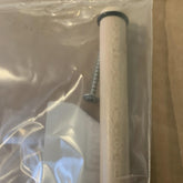 A clear plastic bag containing a Louët Replacement Beam Handle, designed for Jane, Kombo, and Klik Looms by Louët Inc., featuring a wooden dowel with a rubber ring on one end and a silver screw next to it. The bag is partially transparent, revealing the contents inside. Ideal as a replacement part for Louet looms, the background includes some cardboard packaging.