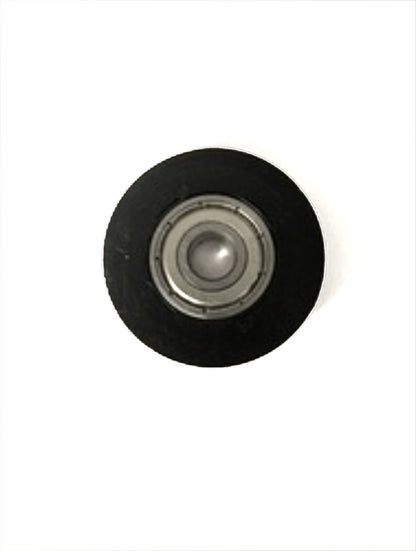 A Louët Roller with ball bearing standard from Louët Inc., featuring a black circular design with a silver metallic center, is placed against a plain white background.