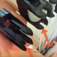 Close-up of two black zipper sliders being compared. One is labeled "old" with an arrow pointing to its rounded edges, and the other is labeled "new" with an arrow highlighting its sharper, more defined edges, reflecting the sleek transformation seen in the Louët Shaft End Replacement Kit for Spring/Delta Loom by Louët Inc.