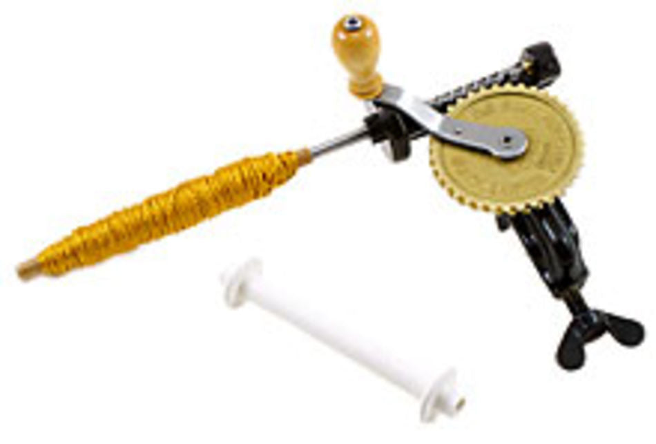 The Swedish Spindle Single-Ended Hand Bobbin Winder by Glimakra is pictured, featuring a clamp base for securing to a surface, a crank handle with a wooden grip, and a rotating gear mechanism. Additionally, this versatile weaving tool includes a white detachable spindle for guiding the yarn that lies beside it.