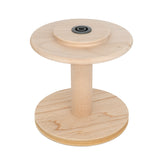 The Ashford Jumbo Bobbin, crafted by Ashford Handicrafts Limited, features a wooden design with two circular ends and a cylindrical center. At the top end, there's a small black metal piece situated against a white background.