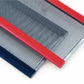 Close-up of two parallel metal combs with fine teeth, featuring red and blue handles, crafted from industrial quality stainless steel reeds by Gowdey. These Assorted Steel Reeds for Floor & Table Looms are displayed against a white background.