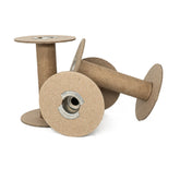 Three empty Cardboard Spools 4" from Marshall Paper Tube Co, featuring cylindrical shapes with flat circular ends and metal cores, are stacked at varied angles against a white background. These sturdy spools are perfect for yarn management, appearing strong and suitable for holding thread or wire.