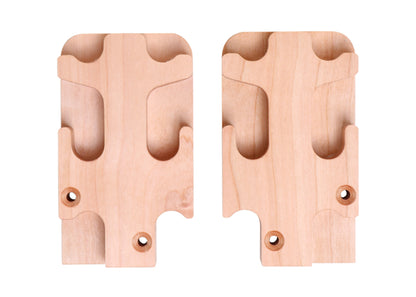 The Ashford Second Rigid Heddle Support Block Kit by Ashford Handicrafts Limited contains a pair of wooden wall brackets designed with curved slots to securely hold objects in place. Each bracket features two pre-drilled screw holes for easy mounting and showcases smooth edges and a natural wood finish, making them an ideal support solution for knitters' looms or rigid heddle looms.