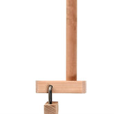 The Ashford Warping Peg & Clamp by Ashford Handicrafts Limited is a wooden game featuring a vertical wooden pole with an attached horizontal bar. It includes a short string attached to the horizontal bar, capturing a metal ring, from which hangs a wooden block.