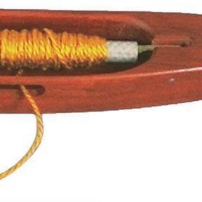 Close-up image of the Dovetail Woodworks Quill Shuttle holding yellow thread, often seen when weaving on looms. The slender, elongated shuttle by Dovetail has a central groove where the thread is wound and a pointed end to pass through the warp threads on a loom.