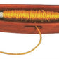 The image shows the Dovetail Woodworks Quill Shuttle, a lightweight wooden weaving shuttle designed in an elongated, boat-like shape, perfect for loom weaving. It holds a cylindrical spool of yellow thread, with one end extending out from the shuttle’s central slot.