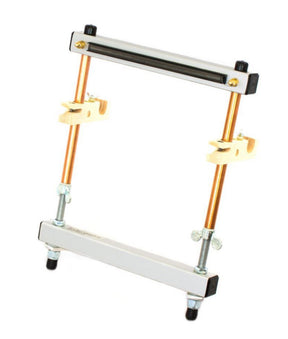 The Mirrix Tapestry Loom by Mirrix Tapestry Looms is a metal and wood device with adjustable clamps and copper rods, ideal for weaving. It features black knobs, screws with wing nuts, and a horizontal top bar with a spring mechanism, all mounted on a white background.