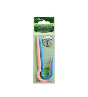 The image displays a package of Bryson Distributing, Inc. Jumbo U Cable Stitch Holders, ideal for knitting with size 15-19 needles. The green packaging features a set of three U-shaped stitch holders in pink, blue, and green, complete with the product description and usage instructions printed on it.