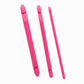 A set of three Fix-A-Stitch Tools from Accessories Unlimited, designed in pink plastic, are laid out side by side against a white background. Each tool features rounded ends and a flat middle section, making them perfect for fixing dropped stitches while knitting.