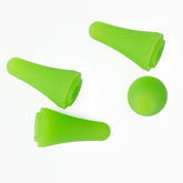 Four green Needle Tip Protectors by Bryson Distributing, Inc. are arranged on a white background. Three protectors lie on their sides while one stands upright, showcasing their conical shape and flexible material, akin to the adaptability found in knitting notions.