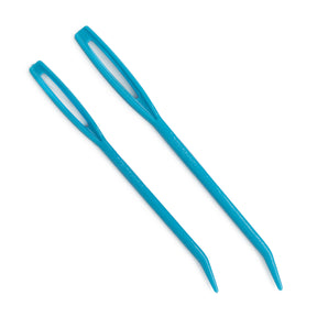 The Plastic Jumbo Tapestry Needles - 2 by Accessories Unlimited are ideal for threading bulky yarns. These two blue plastic needles feature large eyes and slightly curved, blunt tips, making them perfect for weaving through knitted or crocheted fabrics. They are displayed parallel to each other on a white background.