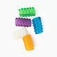 Five translucent, ribbed cylindrical objects in a range of colors—green, purple, blue, white, and orange—resemble vibrantly colored jelly coils. Arranged on a plain white background, the Coil Knitting Needle Holders by Bryson Distributing, Inc. captivate with their coiled-tube appearance.