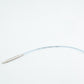 On a white background, the Addi EasyKnit Turbo Circular Needles by Skacel are displayed, featuring a flexible, clear tube connecting two cylindrical metal ends. The sleek tube, reminiscent of a medical device in design, has markings and measurements inscribed on it.