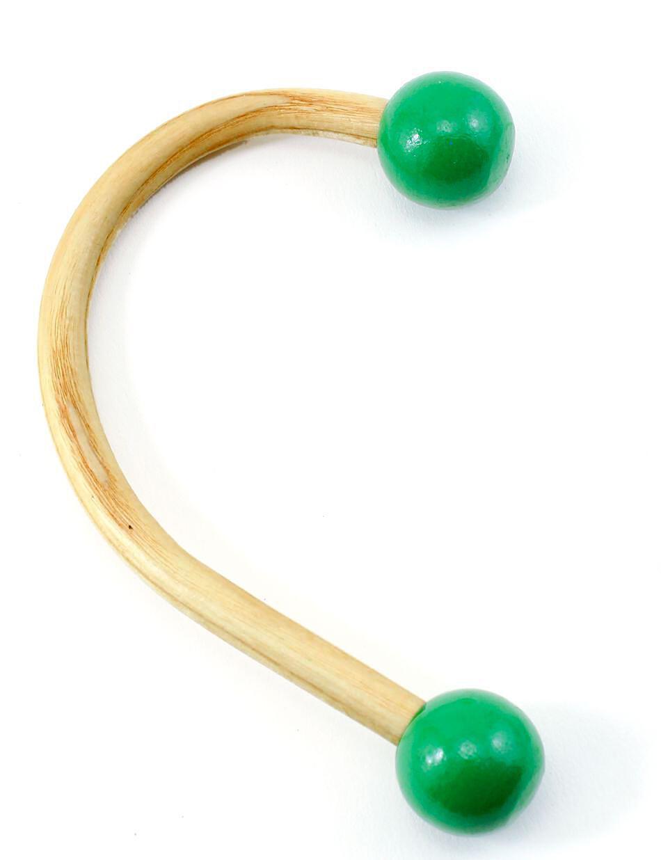 The Sock Hook Christmas Stocking Holder from Christmas Cove Designs is a U-shaped wooden tool with green ball tips on both ends. It features a light, natural wood finish and smooth, polished green balls. This stocking hanger is often showcased against a white background.