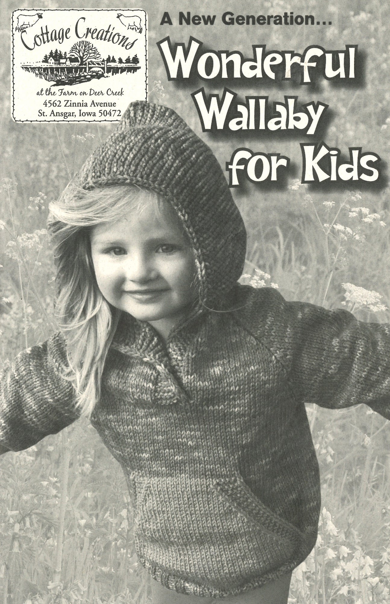 A young child stands outdoors wearing a knitted hooded sweatshirt. The text on the image reads: "A New Generation... Wonderful Wallaby For Kids." There is also a logo for Cottage Creations and an address: 4562 Zinnia Avenue, St. Ansgar, Iowa 50472. The cozy hand-warming pocket and available kids sizes are highlighted in the description.