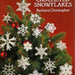 The book cover titled "60 Crocheted Snowflakes" by Barbara Christopher, from Dover Books, features a red background with a small evergreen tree decorated with intricately designed lacy crocheted snowflakes—perfect for unique Christmas gifts. The “Dover Needlework Series” logo is displayed in the upper left corner.