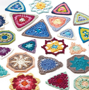 The Crochet Kaleidoscope by Ingram Content features a stunning array of colorful, intricately crocheted motifs set against a white background. This collection includes hexagonal, triangular, and floral patterns in vibrant yarn colors and diverse designs. The seemingly random arrangement accentuates the craftsmanship of each unique piece.