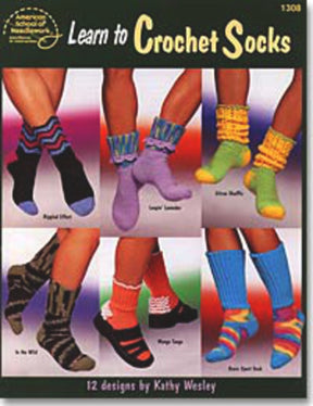 A cover image of a crochet pattern book titled "Learn to Crochet Socks," published by How 2 Books and authored by Kathy Wesley. The cover showcases six photos of different sock designs in an array of colors and styles, all modeled on feet. These crocheted socks, made with sport weight yarn, feature stripes, ruffles, and unique patterns.