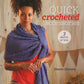 In front of a wooden backdrop adorned with bunting, a woman showcases a purple crocheted shawl over a red dress. The book titled "Quick Crocheted Accessories - 3 skeins or less" by Ingram Content, authored by Sharon Zientara, displays quick crochet projects that effortlessly turn just a few skeins of yarn into chic accessories.