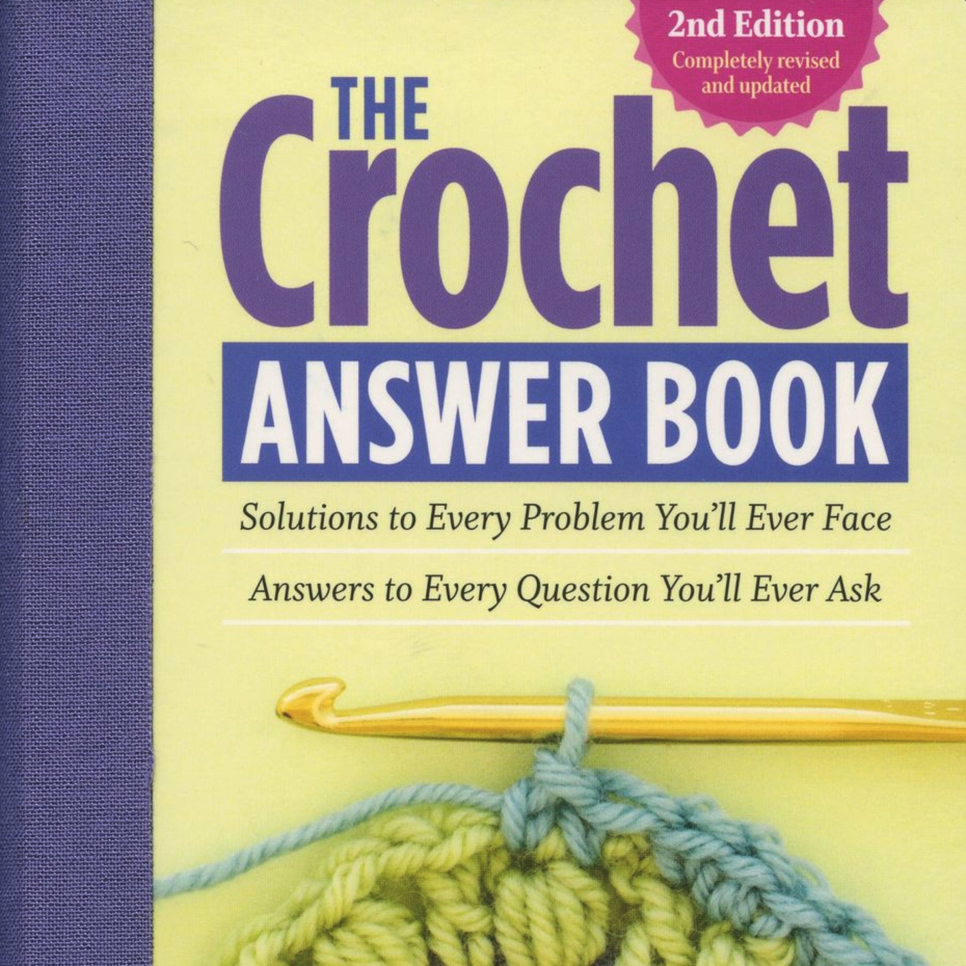 The cover of "The Crochet Answer Book, 2nd Edition" by Workman Publishing - Storey displays a subtitle that reads, "Solutions to Every Problem You'll Ever Face. Answers to Every Question You'll Ever Ask." The cover showcases a yellow crochet hook and a partially completed crochet project, indicating it offers helpful solutions for all your crochet challenges.