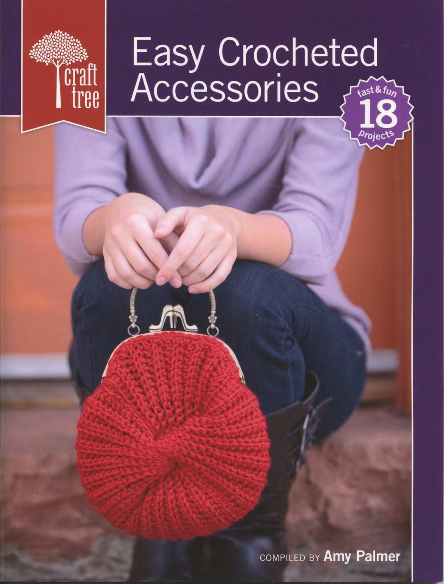 The book cover titled "Easy Crocheted Accessories" from Ingram Content showcases 18 fast and fun crocheted projects. The image features a person sitting with their elbows on their knees, holding a red crocheted handbag with a metal frame. Perfect for creating gifts or stylish hats, the book is compiled by Amy Palmer.